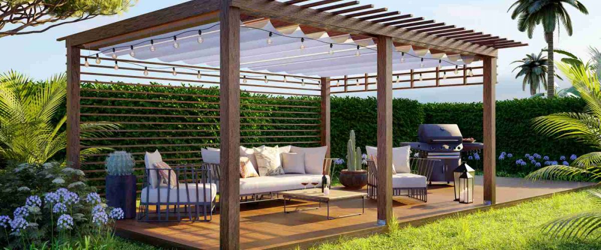 Pergola aus Holz mit Stofflamellen und Gartenmöbeln in einem gepflegten Garten